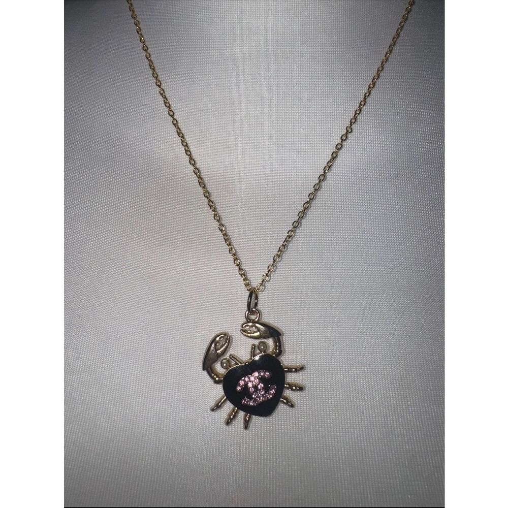 Gold-Tone CHANEL Crab Pendant Necklace with Black and Pink Accent